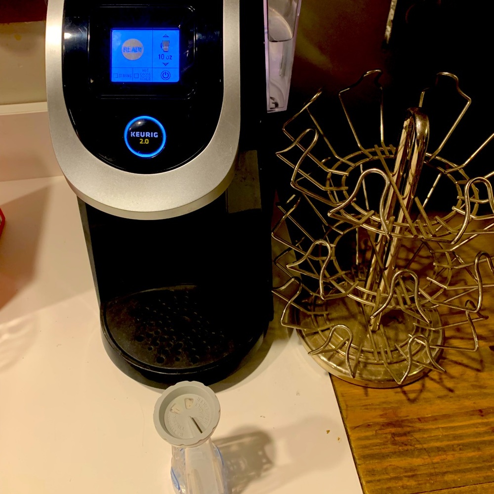 Keurig machine with extra filter and K-Cup holder.